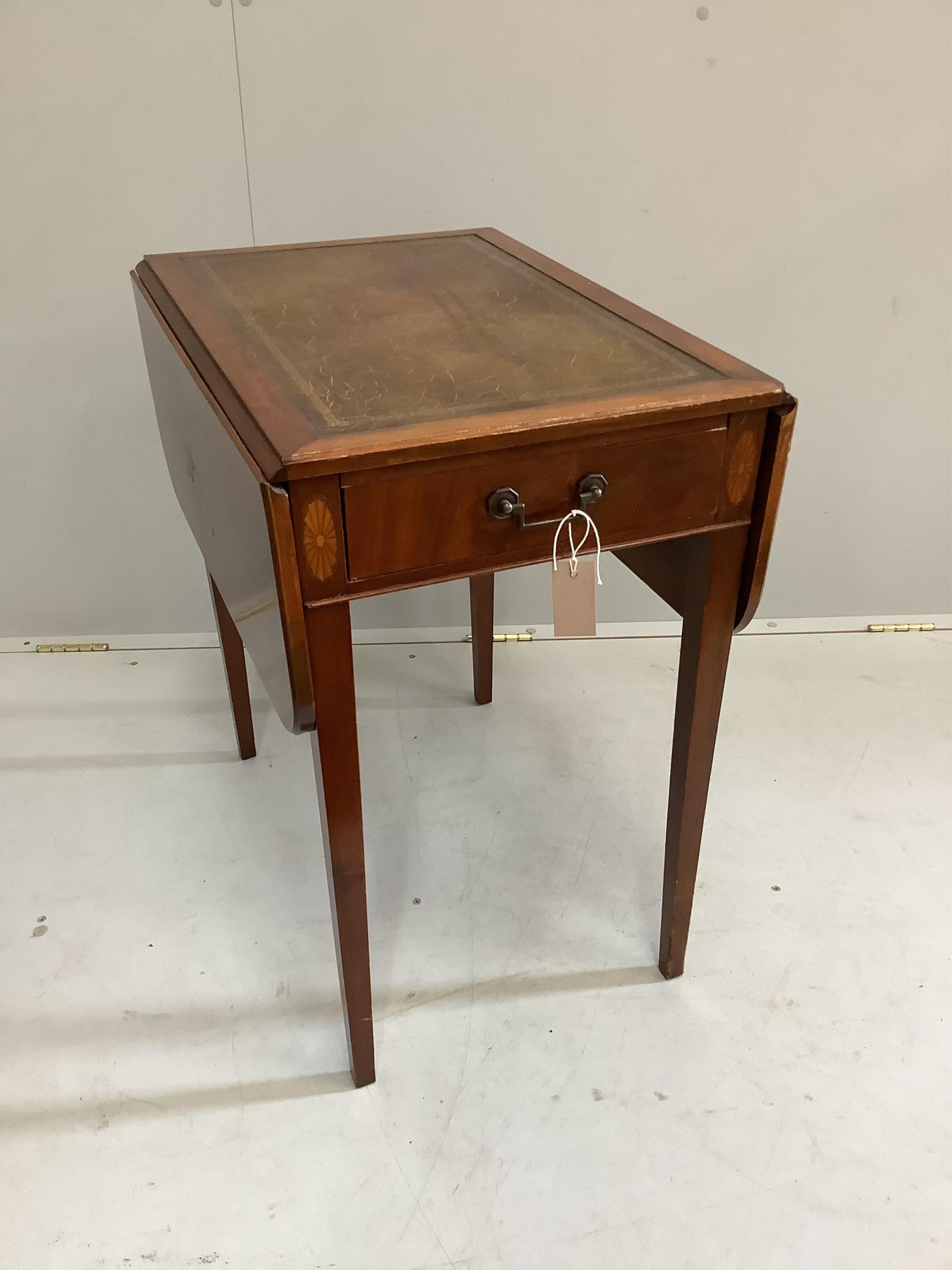 A reproduction George III style mahogany Pembroke table with leather inset top, width 61cm, depth 34cm, height 68cm. Condition - fair